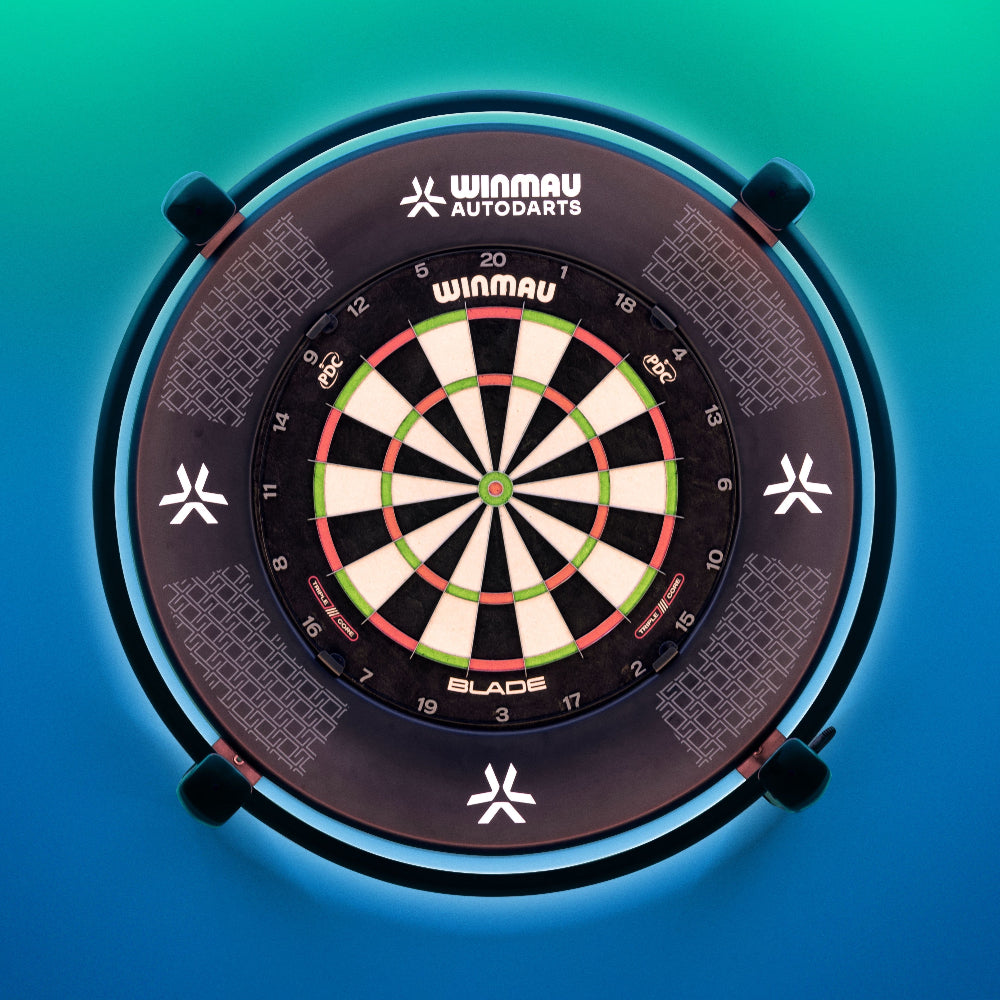 Winmau Autodarts X autoscroring system shown around a Winmau dartboard on a blue and green gradient background.