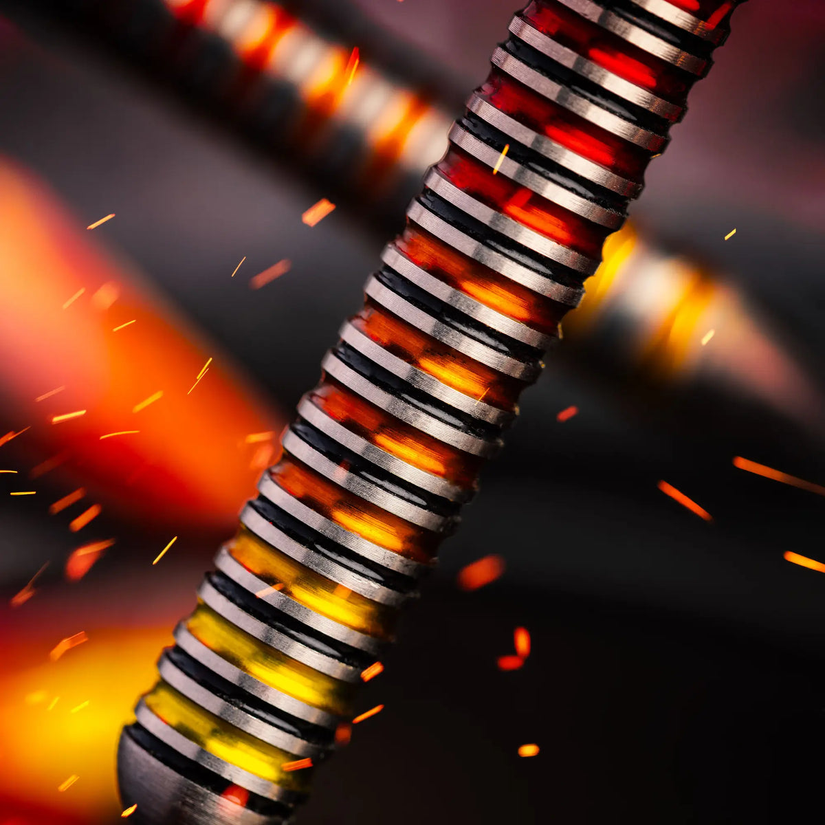 A close-up of a Reddragon Furnace dart with a ribbed silver and black surface, glowing with orange and red heat, surrounded by flying sparks against a dark blurred background.